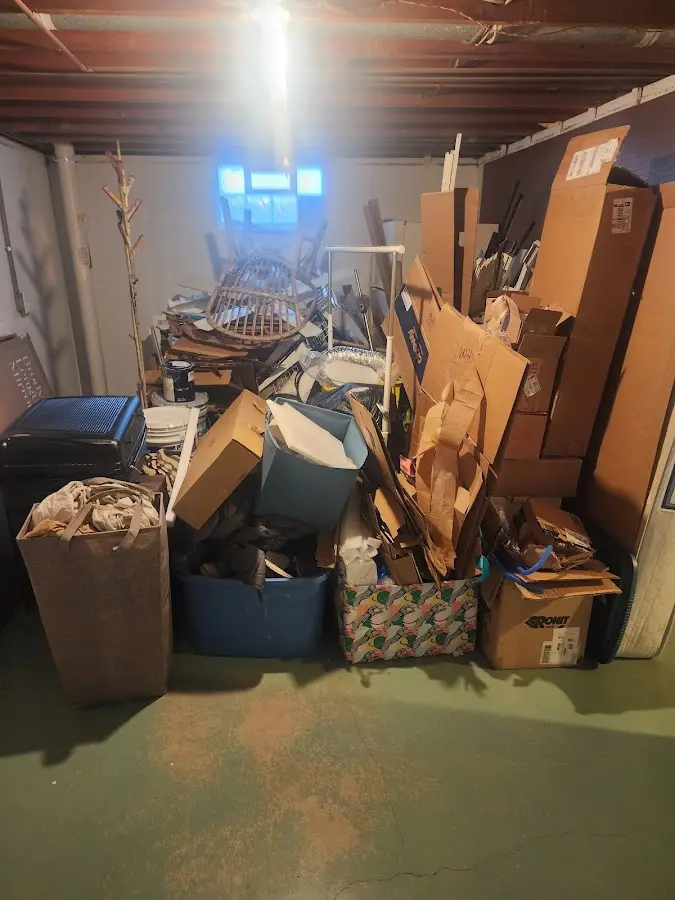 Roll-off dumpster container at job site for 2 Yard Dumpster Rental in Crockery